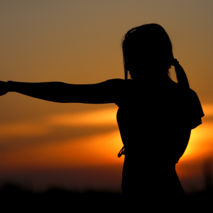 practicing martial arts at sunset